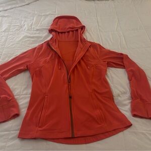 lululemon athletica Vibrant Peach Utility Jacket with hood. 4 pockets